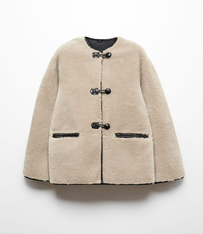 Faux fur coat with applications